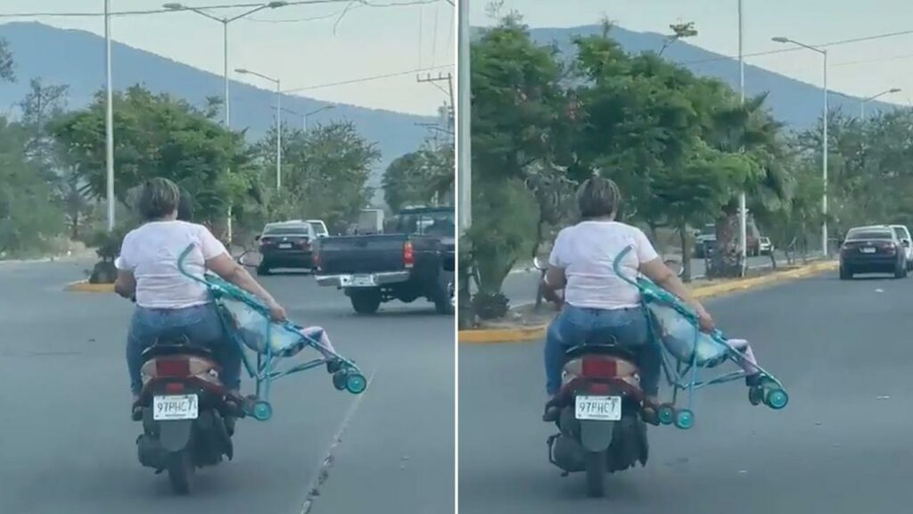 Pareja viaja en moto con su bebé en coche